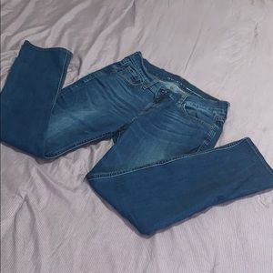 Dark washed jeans that are slightly used